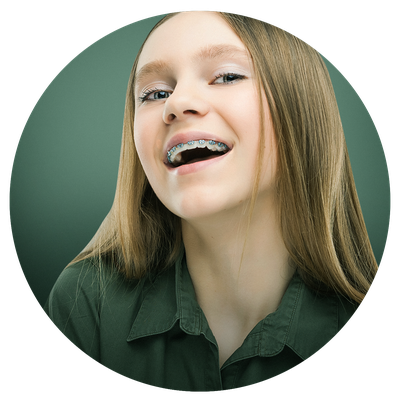 Patient smiling with braces on their teeth